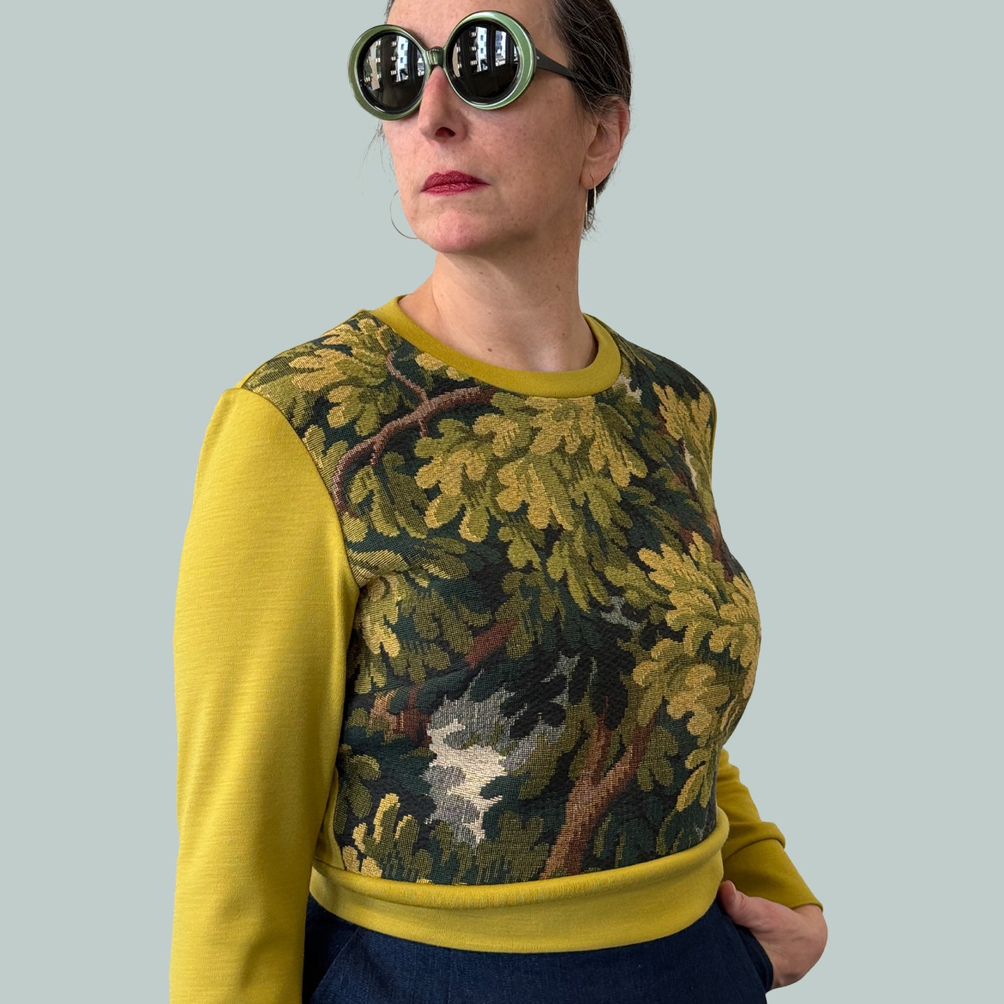 Cropped ladies' sweater with tapestry front and chartreuse Laurent Garigue wool sleeves and back, side view from opposite side
