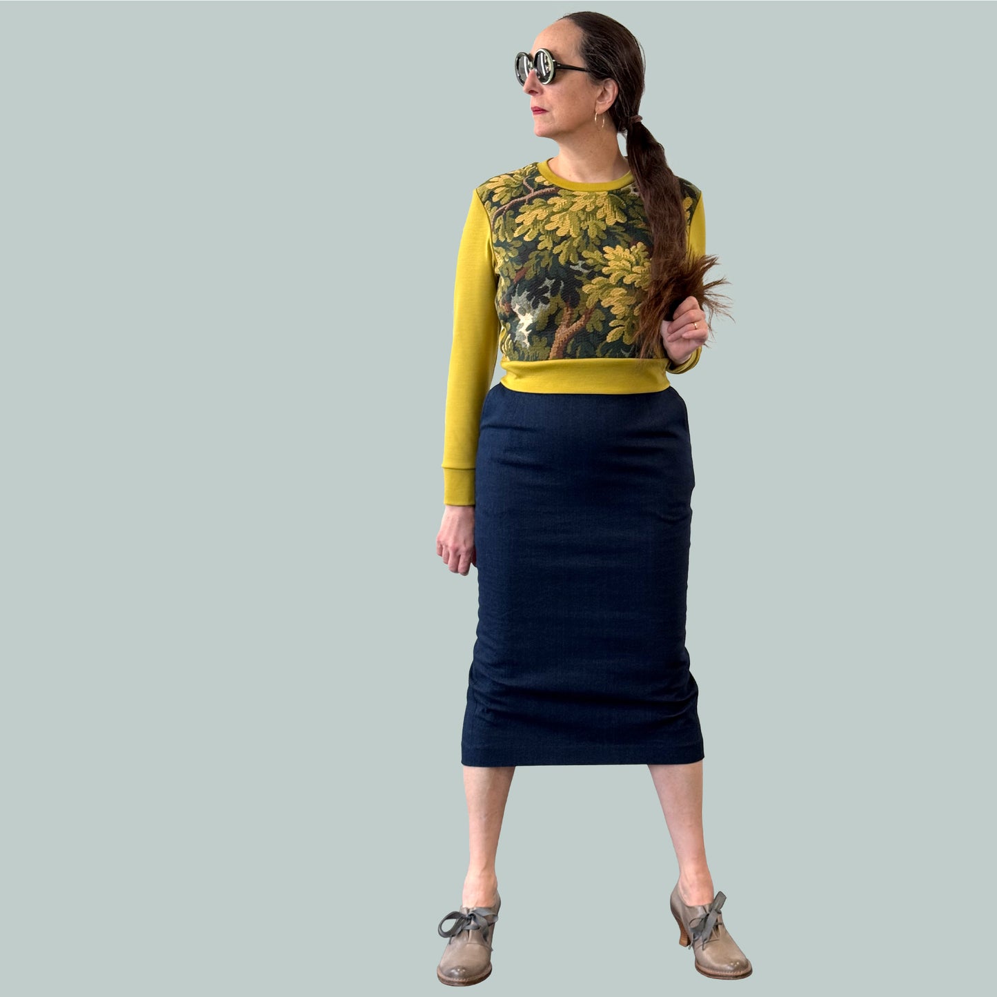 Cropped ladies' sweater with tapestry front and chartreuse Laurent Garigue wool sleeves and back, full body view with pencil skirt
