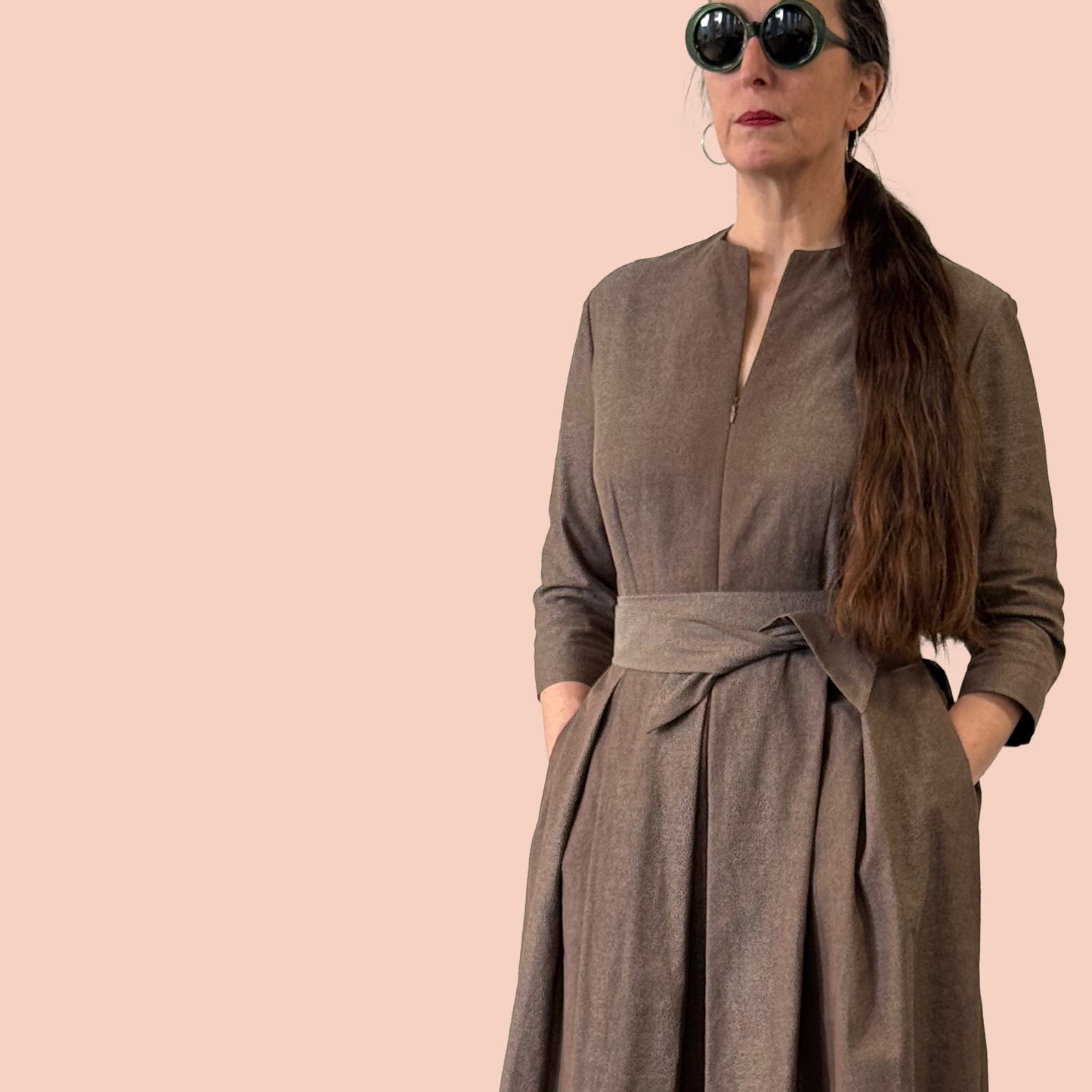 1950s inspired shirtwaist dress in Swiss cotton damask partial side view with hands in pockets