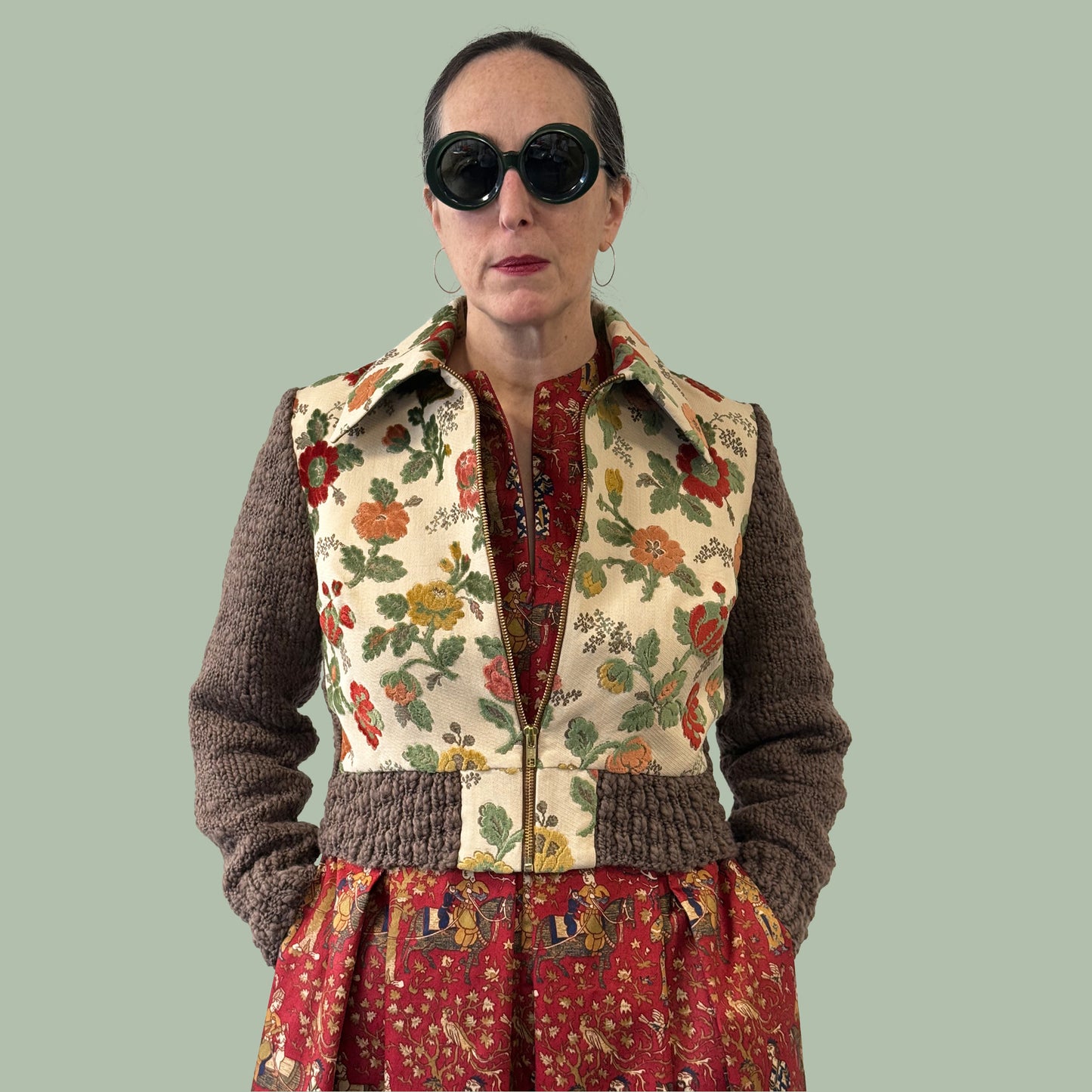 1950s style shirtwaist dress in vintage Waverly Persia print fabric worn with jacket hands in pockets