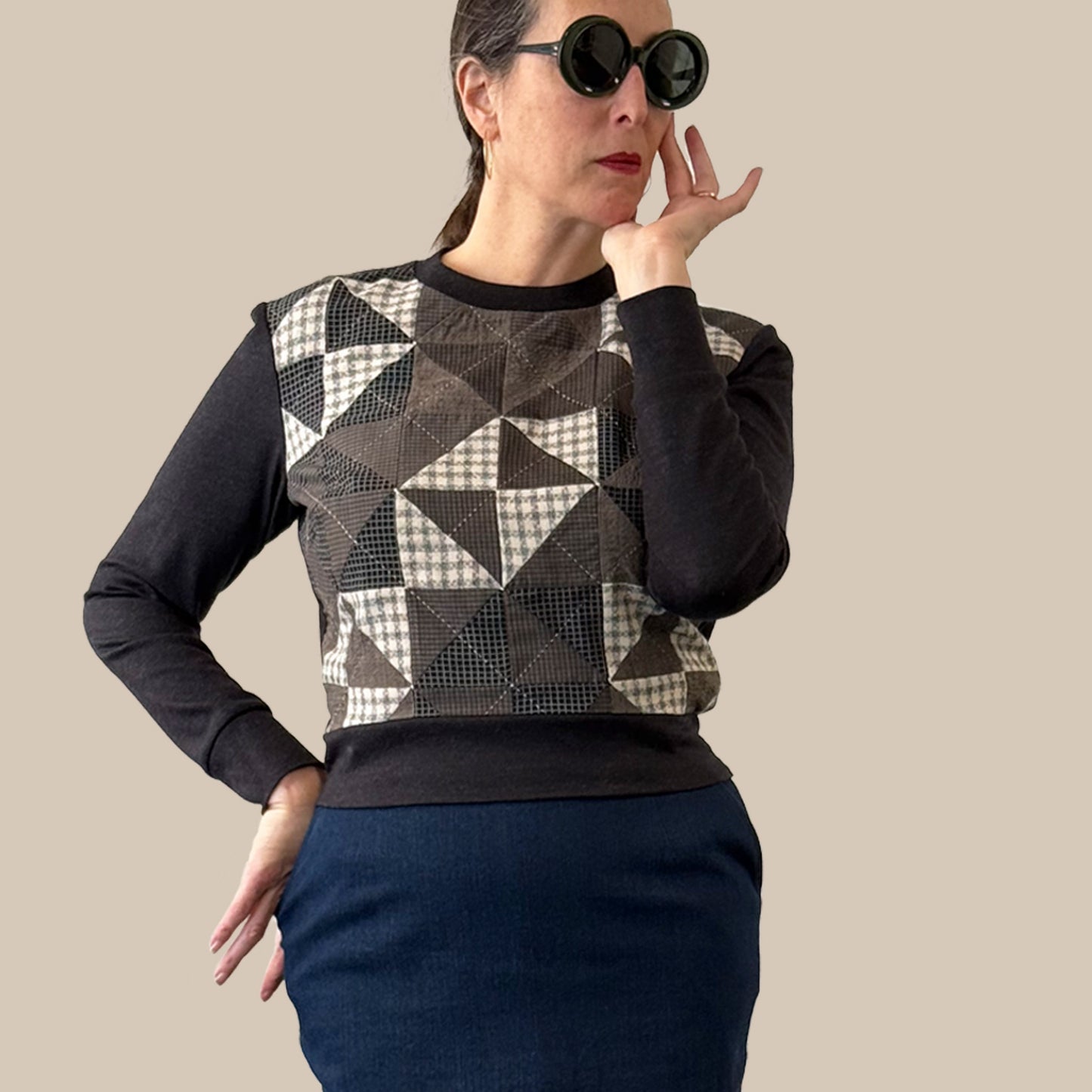 Ladies cropped merino wool sweater with hand pieced and quilted front panel, torso view with pencil skirt