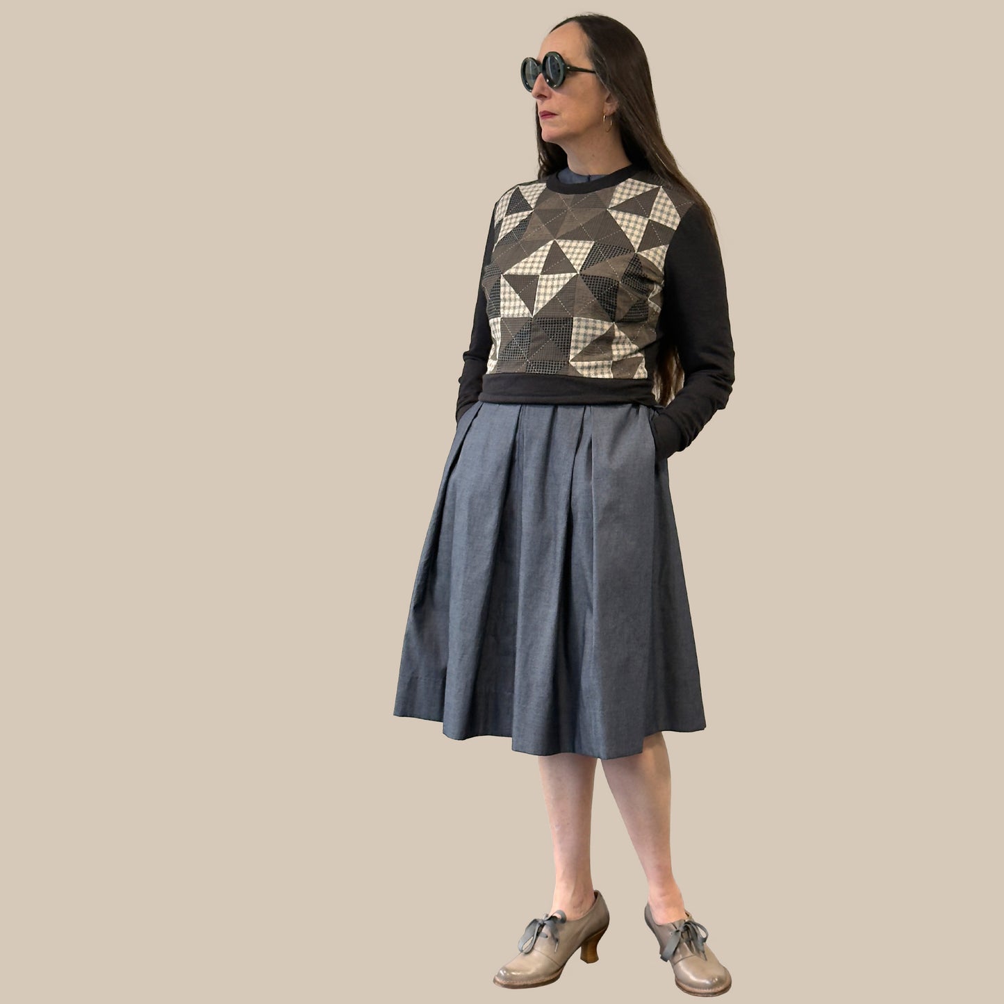 Ladies cropped merino wool sweater with hand pieced and quilted front panel, full body view with full skirt