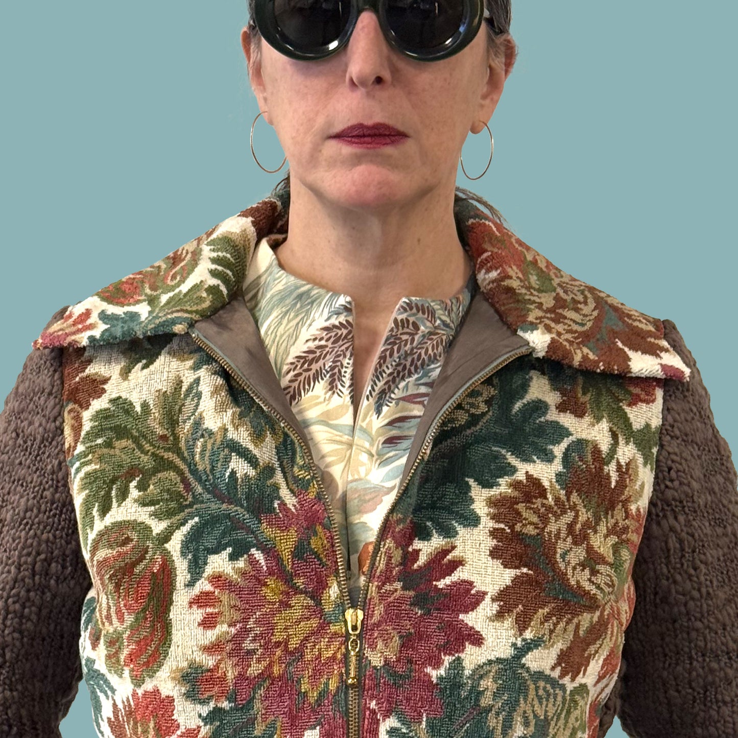 Ladies cropped jacket with vintage floral upholstery fabric front and hand knitted wool sleeves and back, close up
