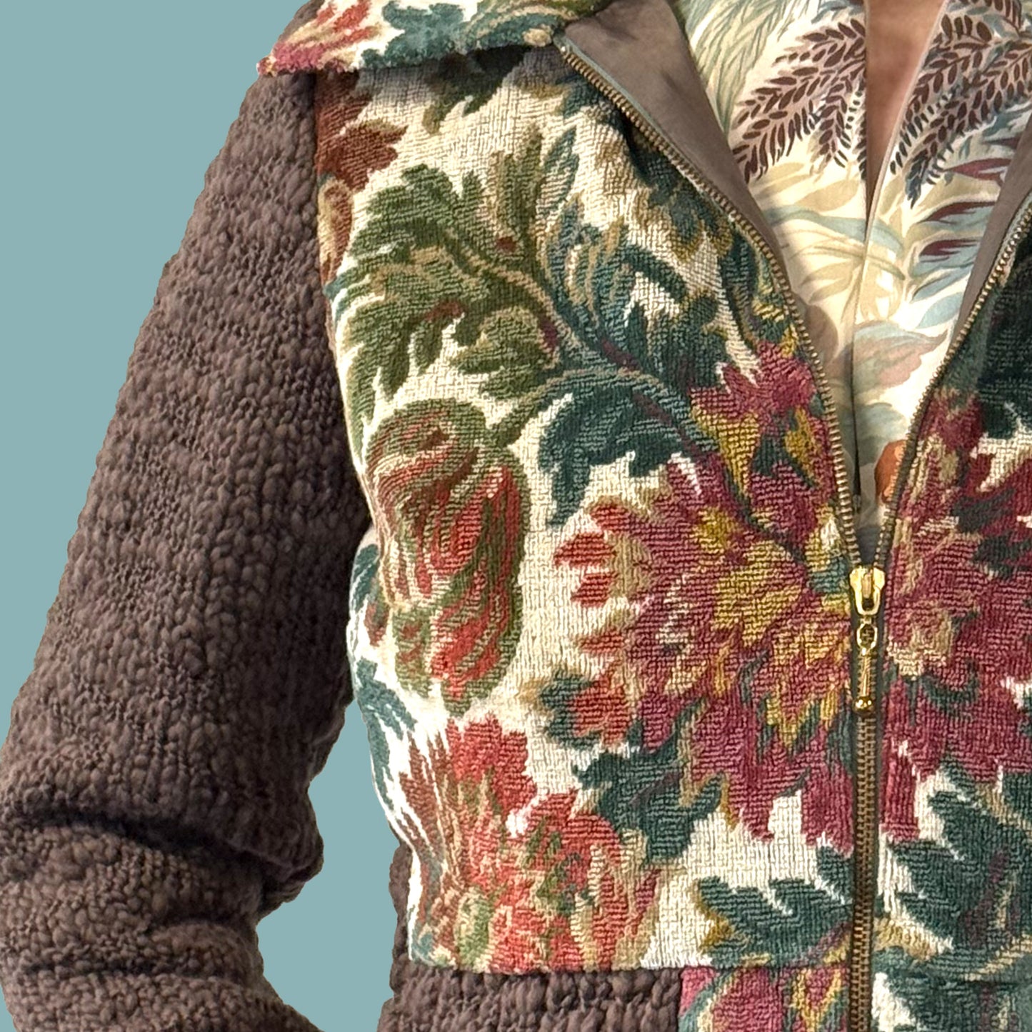 Ladies cropped jacket with vintage floral upholstery fabric front and hand knitted wool sleeves and back, detail view of fabric texture