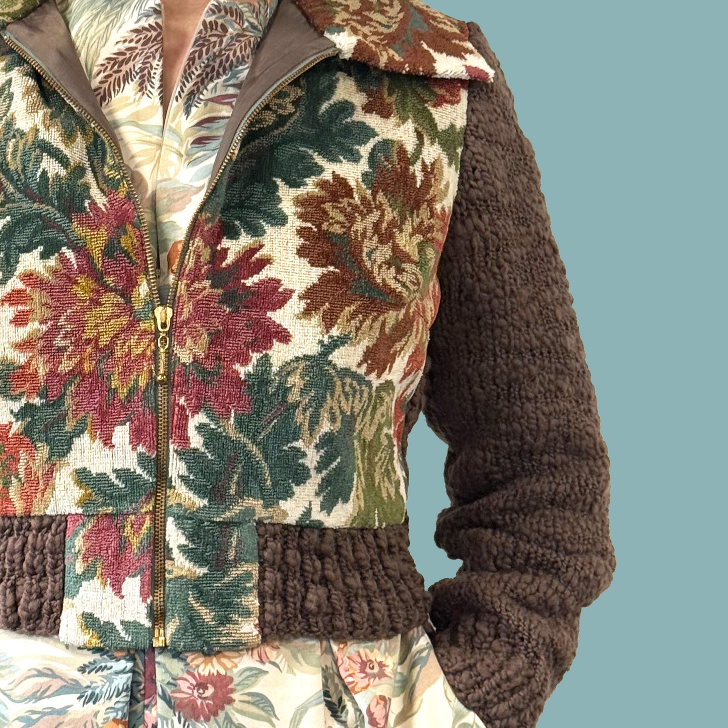 Ladies cropped jacket with vintage floral upholstery fabric front and hand knitted wool sleeves and back, close up of knitted sleeve