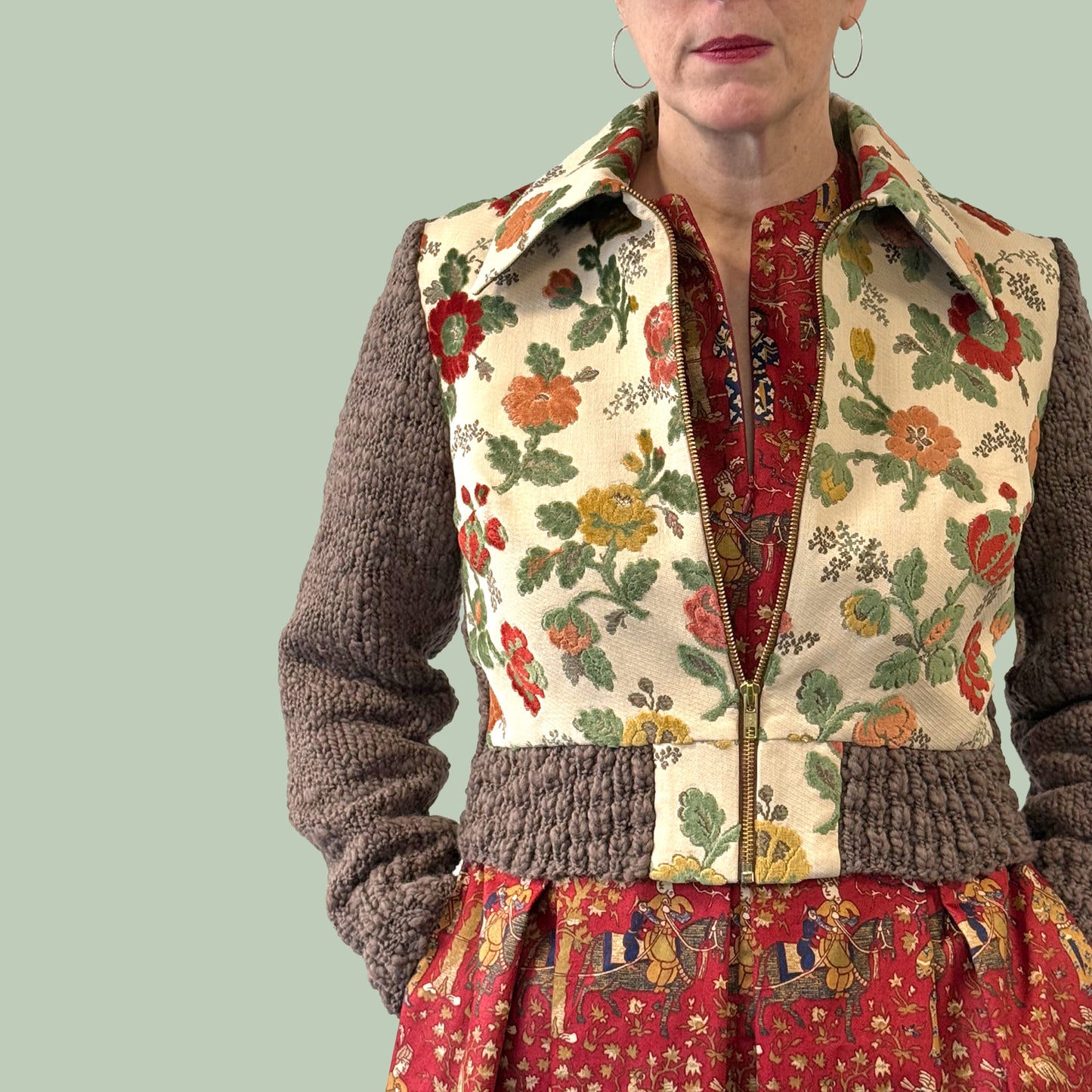 Ladies cropped jacket with vintage upholstery fabric front and hand knitted wool sleeves and back, close up