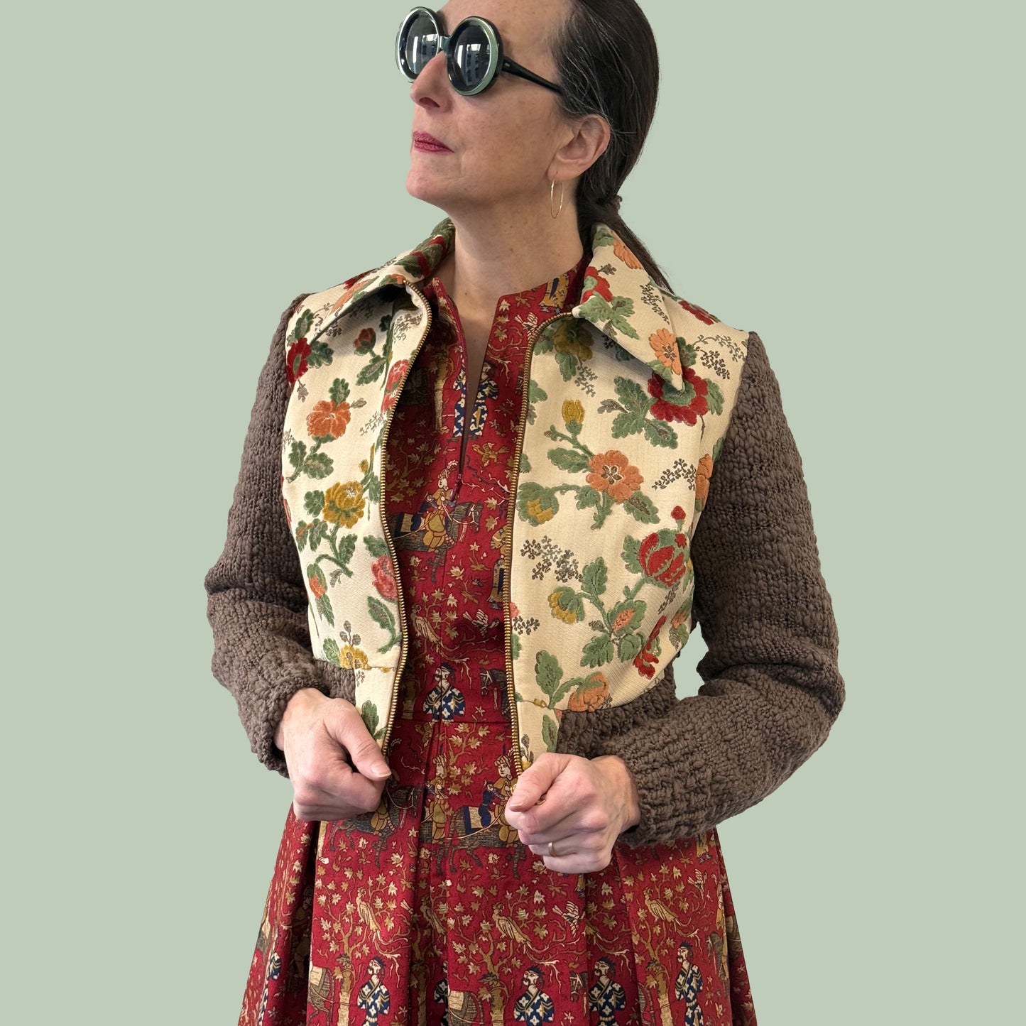 Ladies cropped jacket with vintage upholstery fabric front and hand knitted wool sleeves and back, side view with zipper open