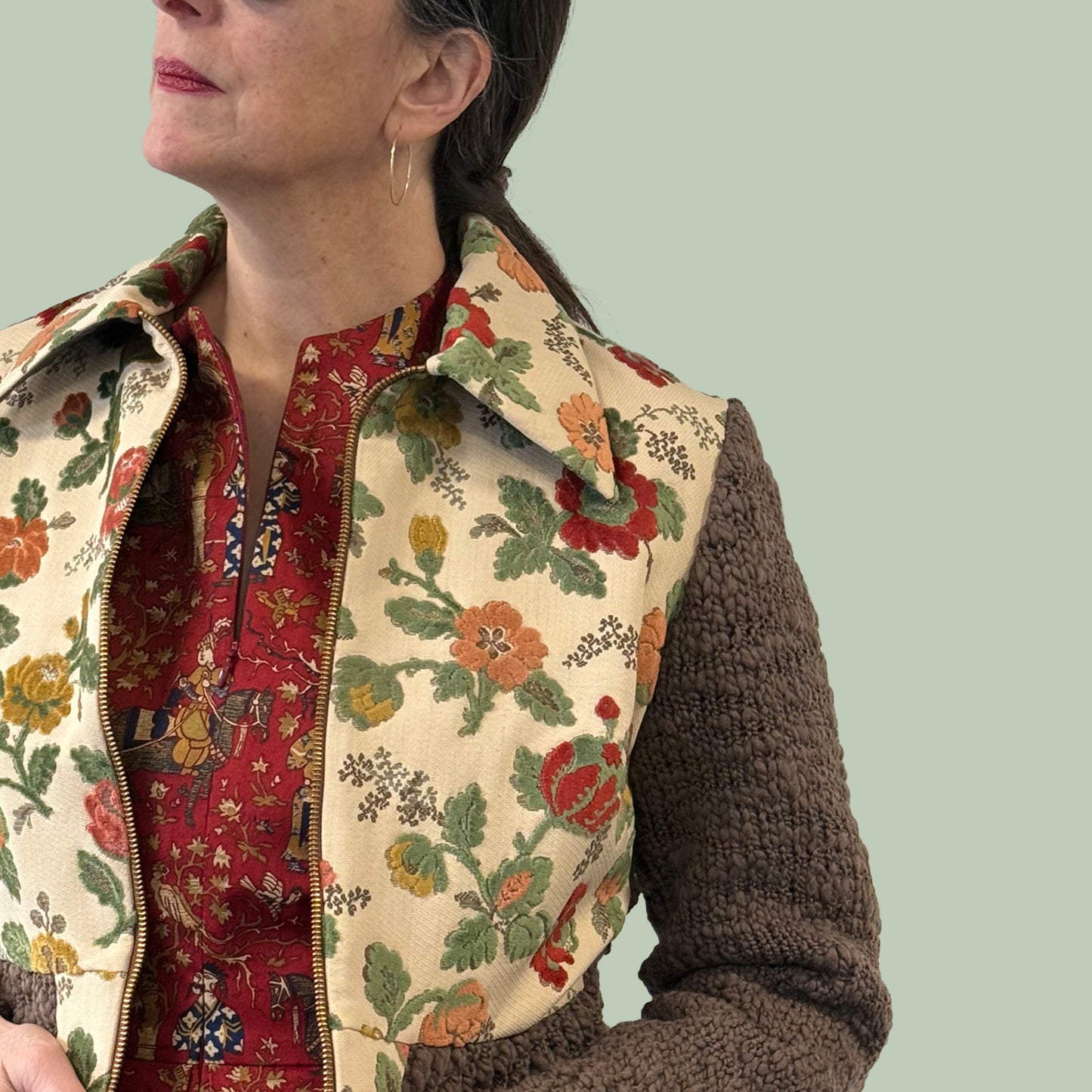 Ladies cropped jacket with vintage upholstery fabric front and hand knitted wool sleeves and back, side view close up